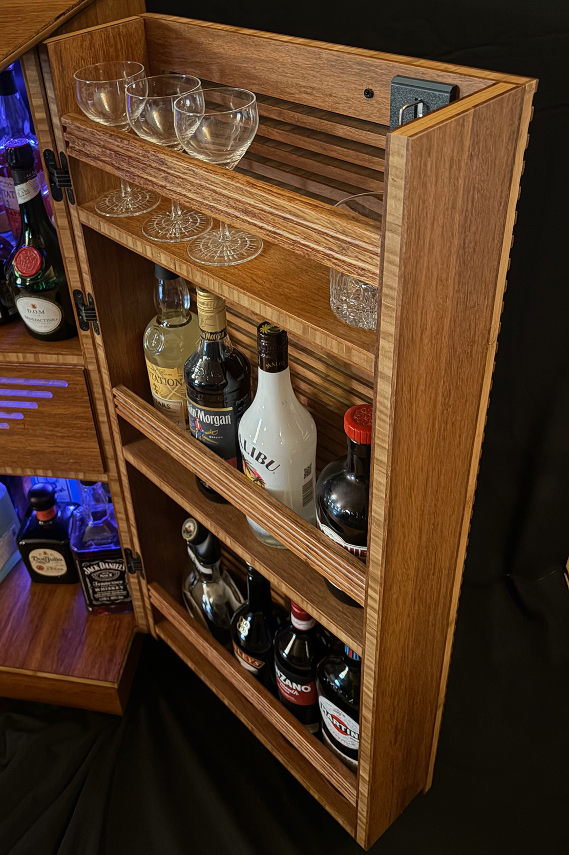 Slatted bamboo door with bottle storage